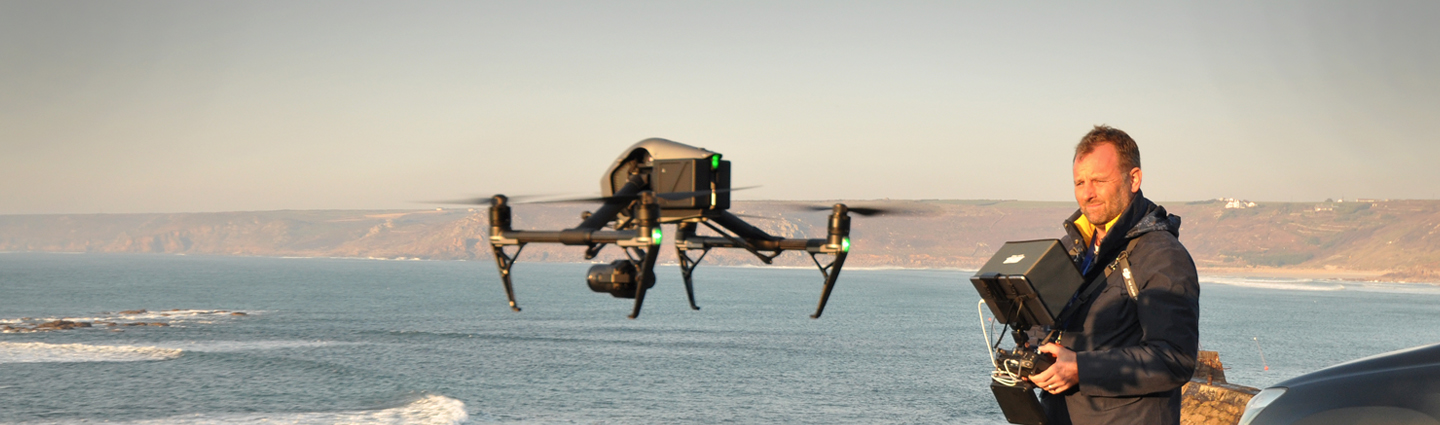 Capt Adrian McDowell flying a DJI Inspire 2 on a clifftop above the sea