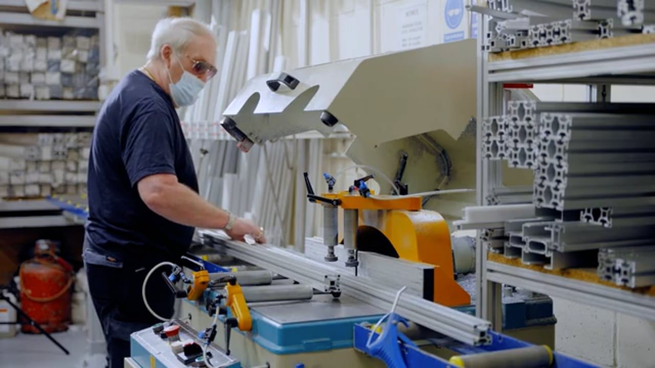 A Monk Conveyors engineer assembling a conveyor system in the workshop