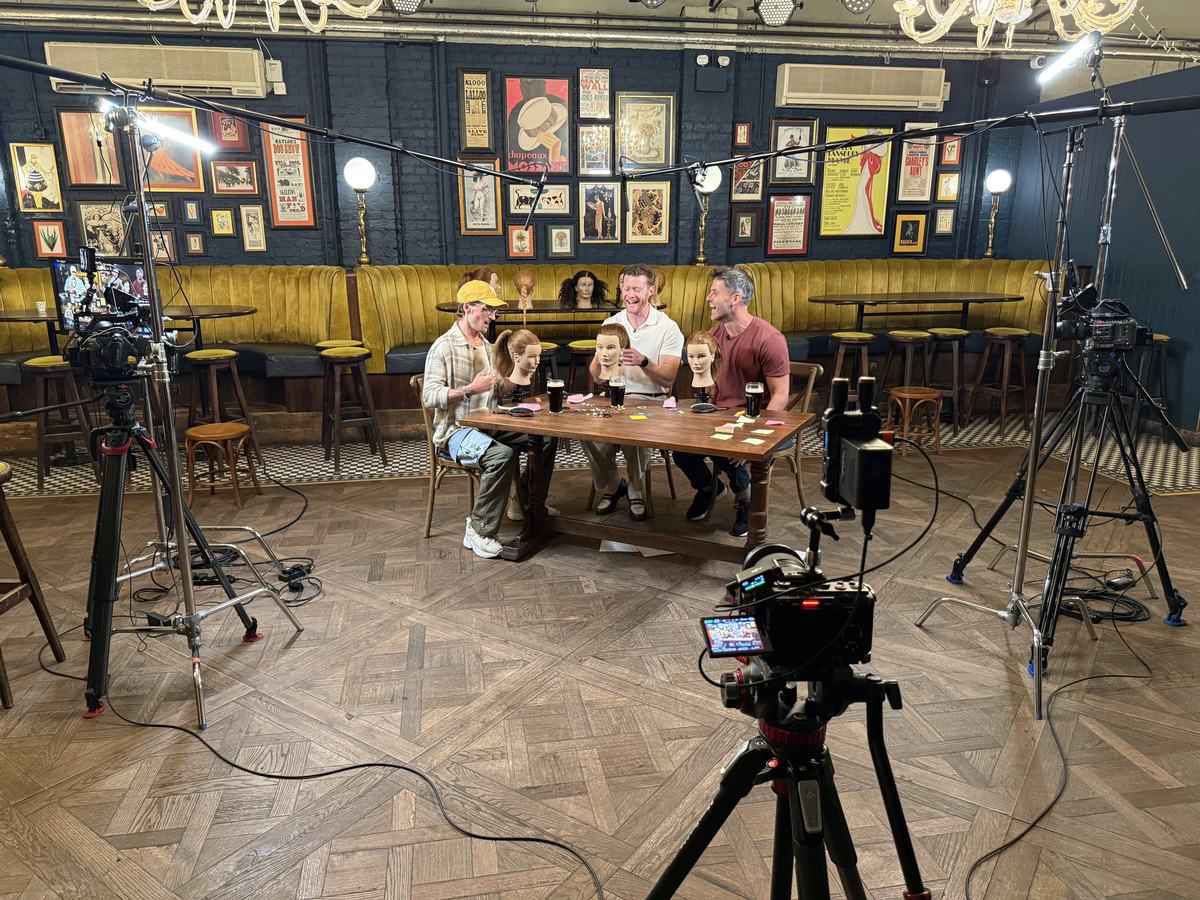 The full pub set: three cameras, a boom overhead and lights either side of the table